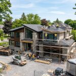 Modern luxury home exterior in Ottawa with landscaped yard and large windows